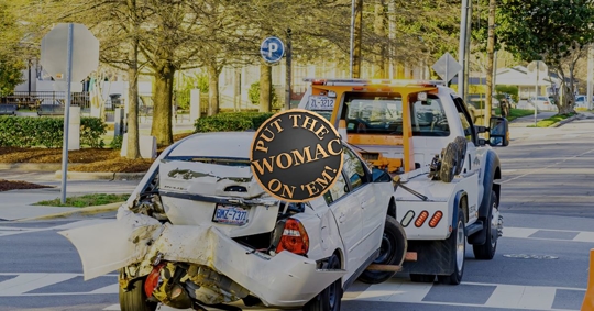 rear ended car being towed away