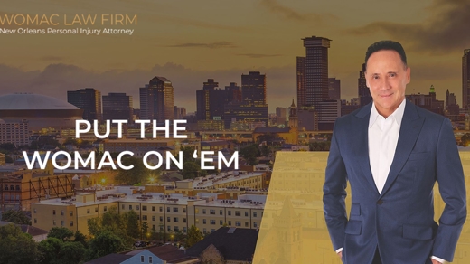 ed womac in front of an image of an overturned car